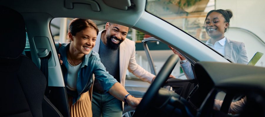 happy-multiracial-couple-looking-at-new-car-in-sho-2023-11-28-04-23-53-utc (2) happy-multiracial-couple-looking-at-new-car-in-sho-2023-11-28-04-23-53-utc (2)