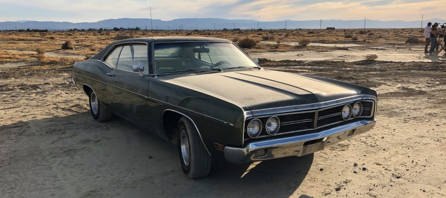 sedan-parked-deserted-area-cloudy-sky